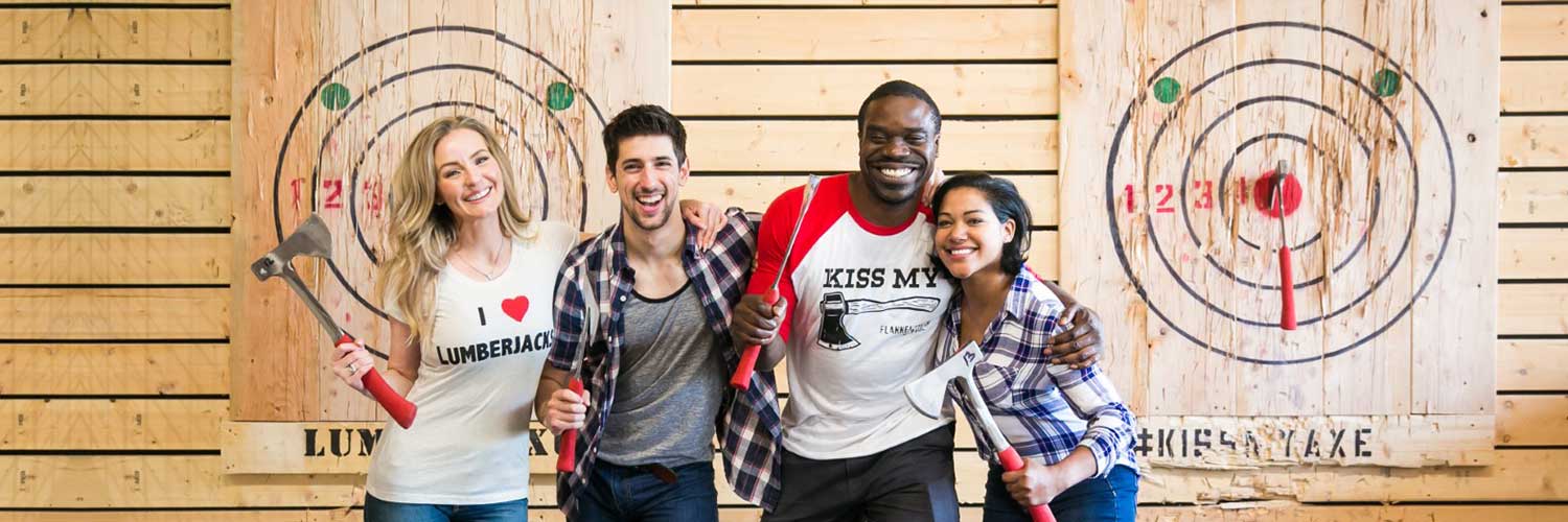 Group enjoying axe throwing as a fun social activity