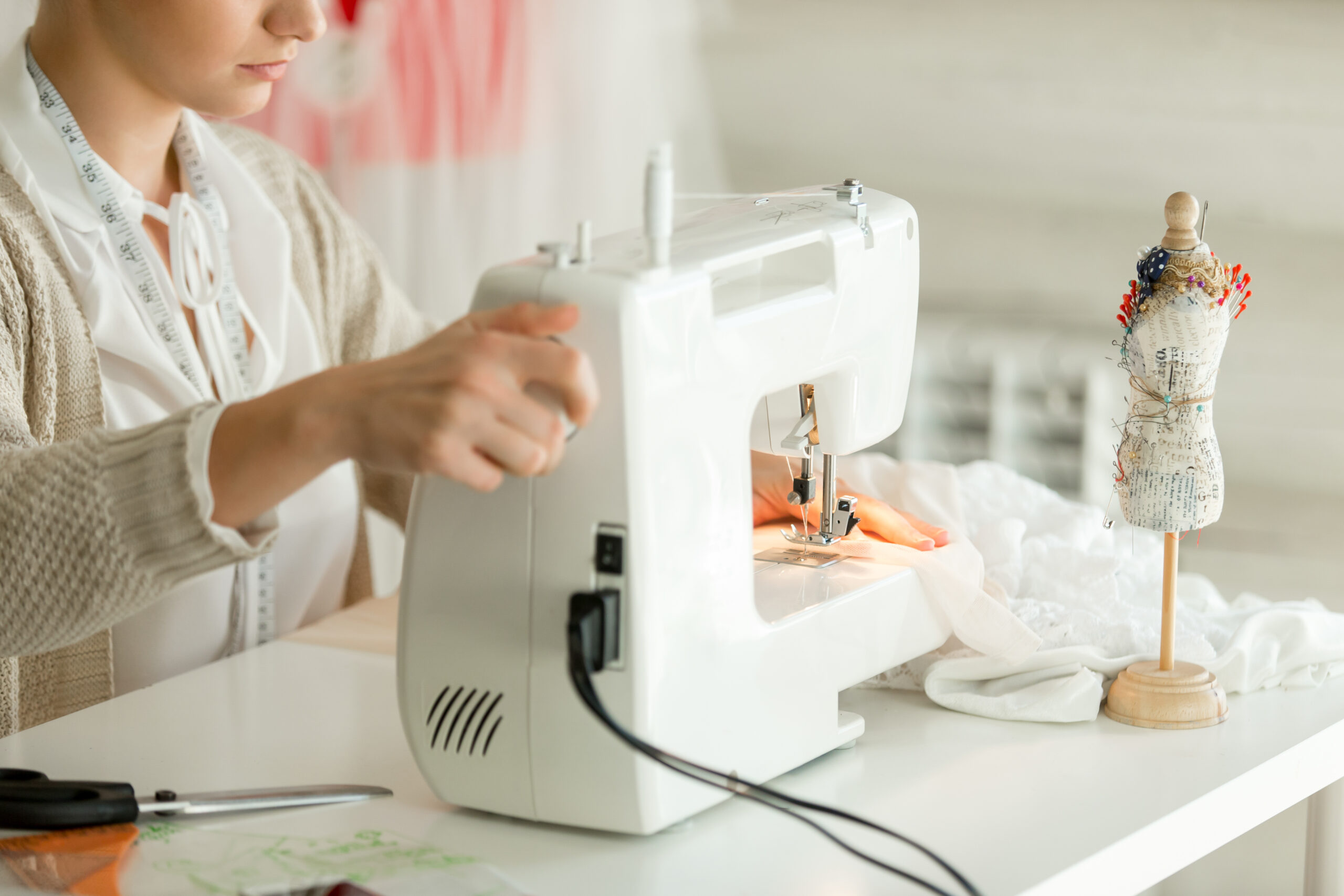 A collection of beginner-friendly sewing machines displayed on a bright, inviting background.